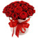 красные розы в шляпной коробке